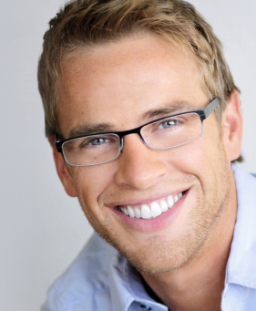 Smiling blonde man with glasses